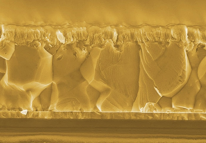 Bifacial CIGS solar cells consist of very thin layers, only 3µm in total for the active materials. Deposited on top of a transparent electrical contact, the CIGS polycrystalline layer absorbs the light from both front and back sides. (Courtesy of EMPA.) 