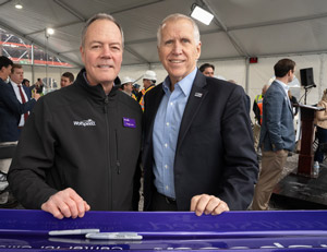 Senator Thom Tillis joined Wolfspeed’s president & CEO Gregg Lowe in signing the ceremonial ‘last beam’ at the Topping Out ceremony for The John Palmour Manufacturing Center for Silicon Carbide. 