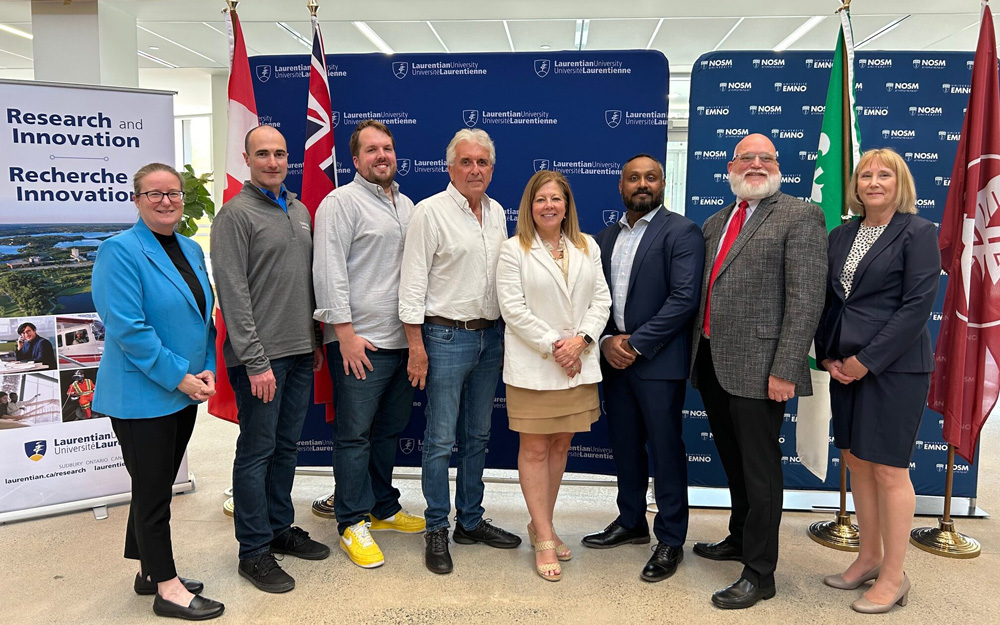 (From left): Dr Tammy Eger, Chris Granger of Glencore, Dr Corey Laamanen, Dr John Ashley Scott, Sudbury MP Viviane Lapointe, Dr Sujeenthar Tharmalingam, Dr David Marsh, and Dr Lynn Wells at the announcement of the NSERC grant. (Photo: Laurentian University). 