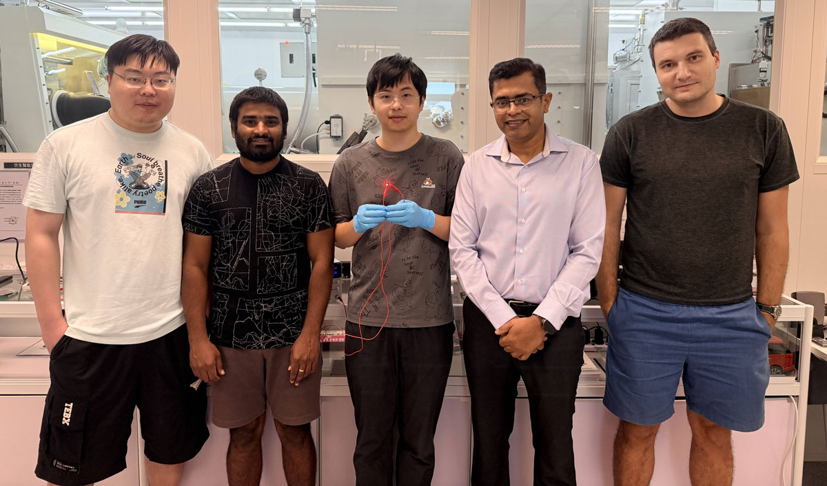 The research team: corresponding author professor Abhishek K. Srivastava (second right); PhD student and first author Liao Zebing (center, holding a red-emitting QR-LED sample); and co-authors including postdoctoral fellow Dr Maksym Prodanov (first right), PhD students Mallem Kumar (second left) and Song Jianxin (first left). 