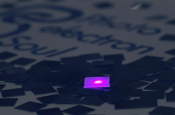 At the center, the violet glow of a GaN photocathode, surrounded by silicon crystals. (Photo courtesy of Photo electron Soul Inc.) 