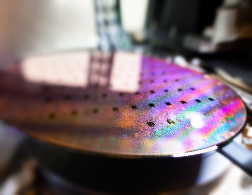 III-V semiconductor dies bonded to 300mm wafer using direct bonding and high-precision alignment (photo courtesy of redit: AUBERT/CEA). 